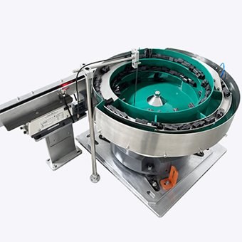 Linear discharge track connected to a component bowl feeder